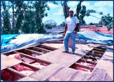 Dan Adams on a roof during a structural rebuild